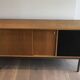 Sideboard with double sliding doors and bar on a metal base