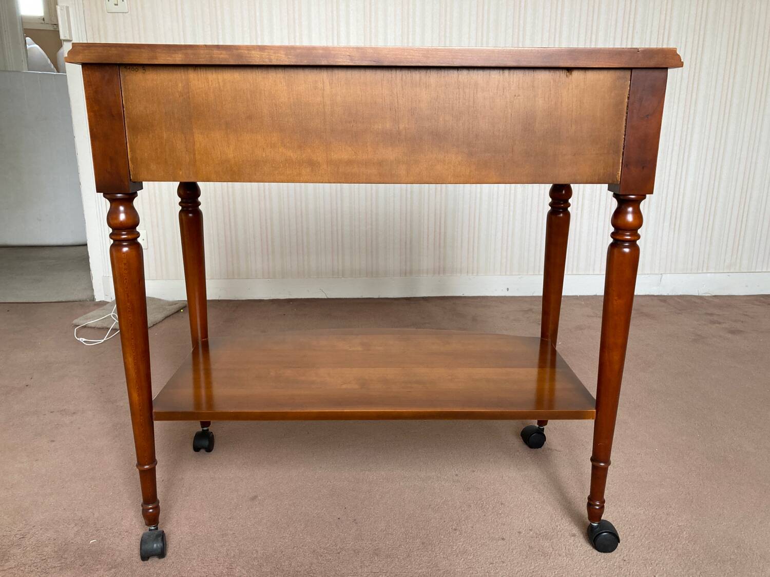 Wooden TV cabinet on casters