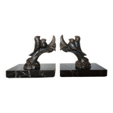 Art Deco bookends signed Frécourt, patinated metal & black marble