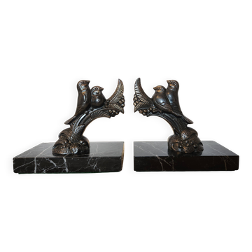 Art Deco bookends signed Frécourt, patinated metal & black marble