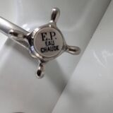 Set of a sink and its retro ceramic splashback.