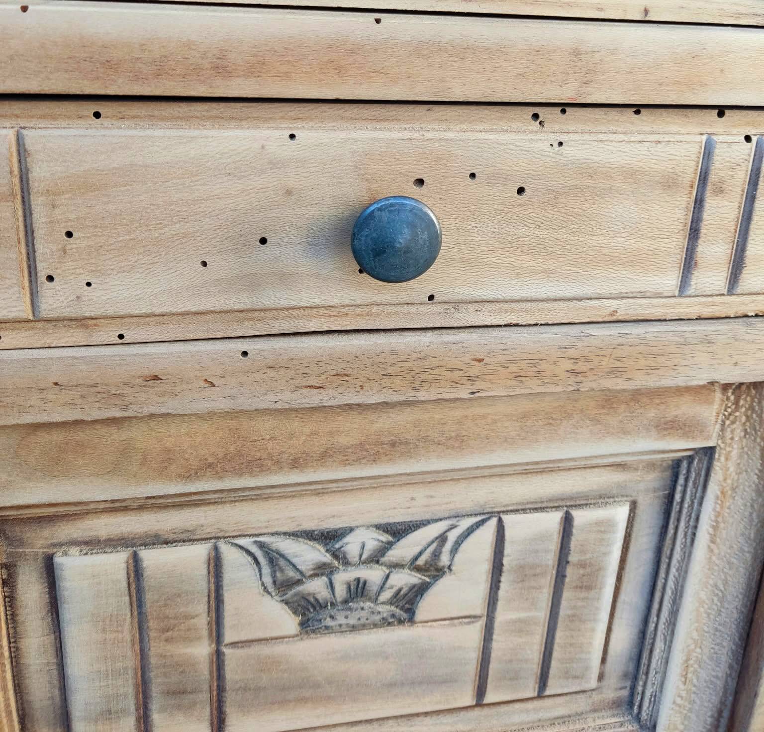 Small Art Deco bedside table in light wood with a terrazzo effect top.