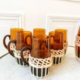 set of carafe and 6 cups in amber glass with wicker from the 70s