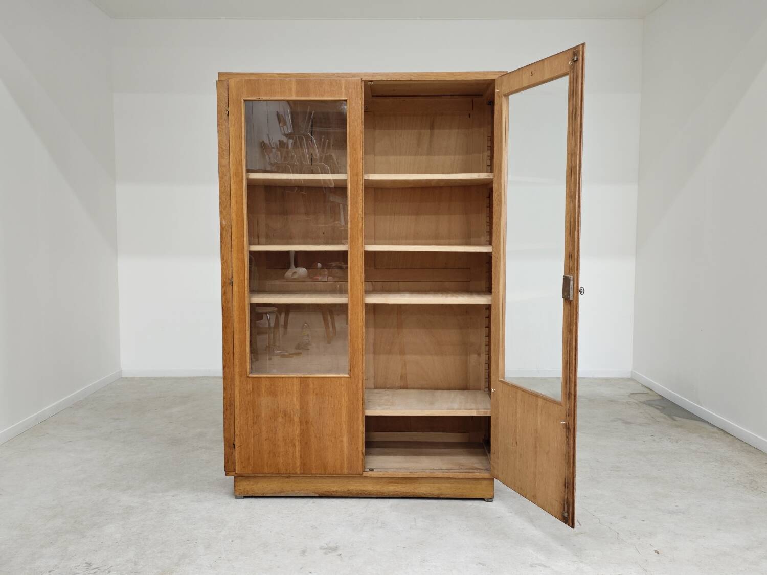 Oak glass-fronted school cabinet 1960