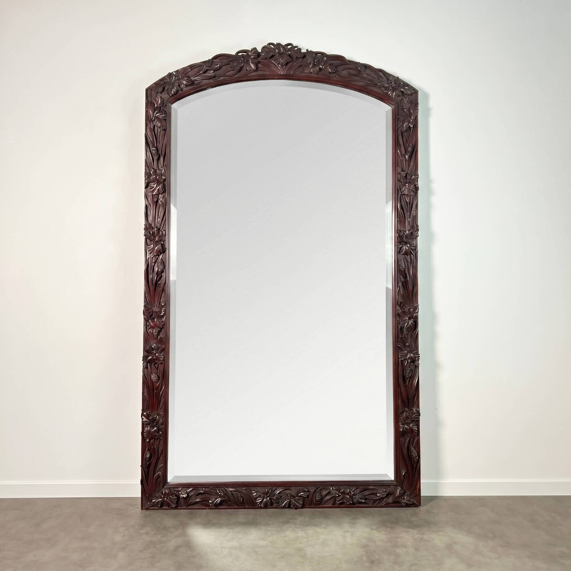 Large mirror (2 metres) Art Nouveau in carved mahogany with high-relief decoration.