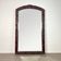 Large mirror (2 metres) Art Nouveau in carved mahogany with high-relief decoration.