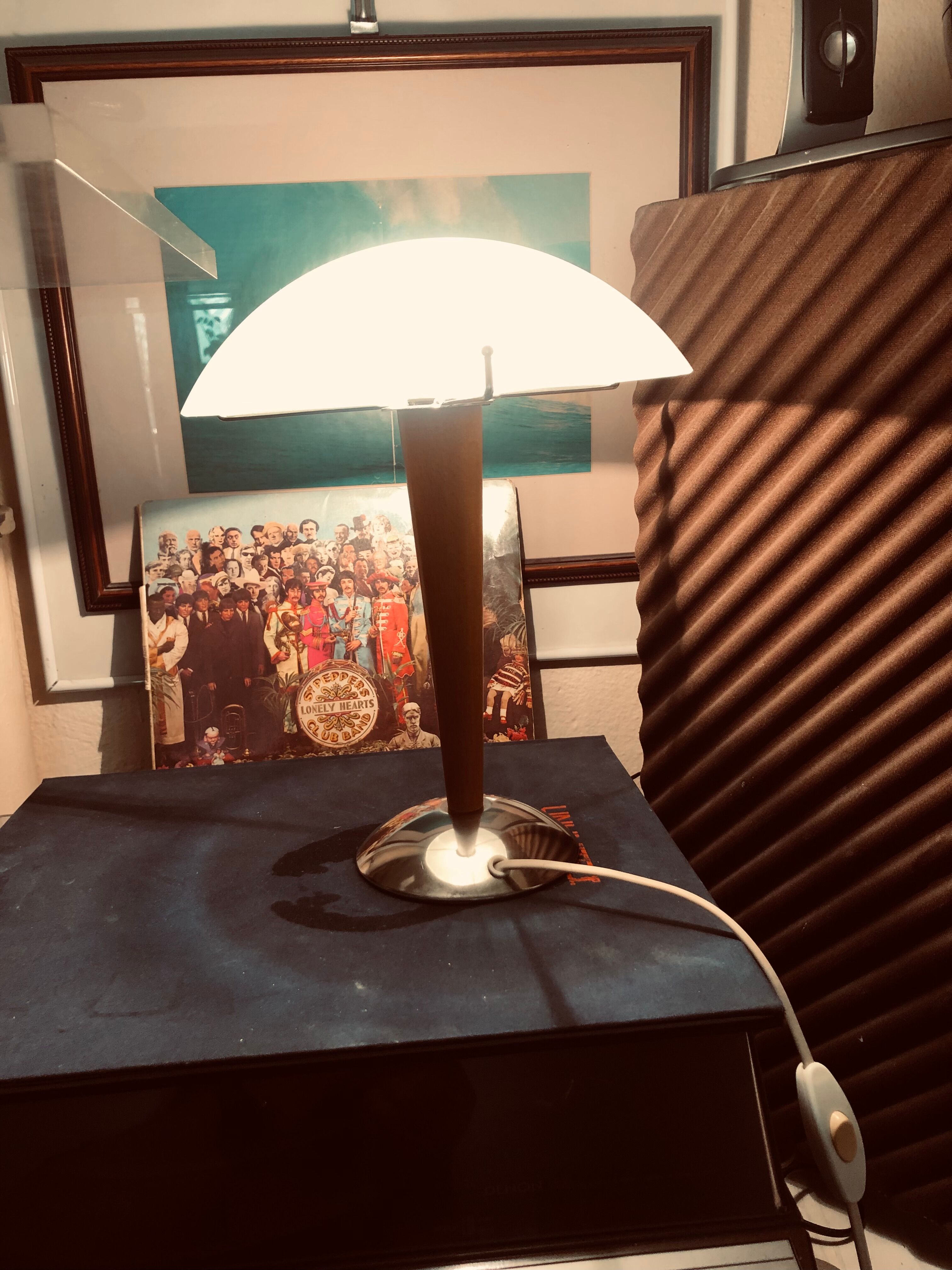 Table lamp legs chrome wood lampshade opaque glass.