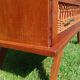 Rattan and wood splayed-leg chest of drawers