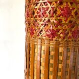 Old insulated bottles in woven bamboo