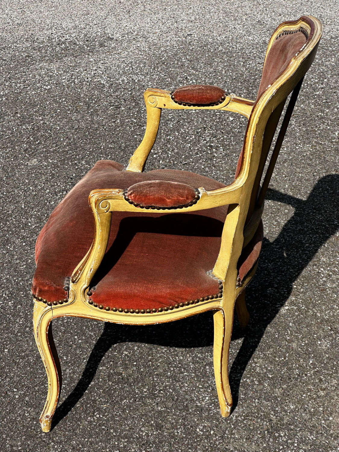 Louis XV cabriolet armchair, patinated wood and antique velvet.