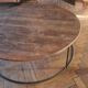 Large round coffee table in wood and wrought iron.
