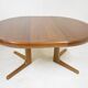 Expandable round teak table