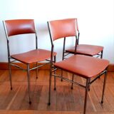 Three mid-century chairs in faux leather and chrome from the 1950s.