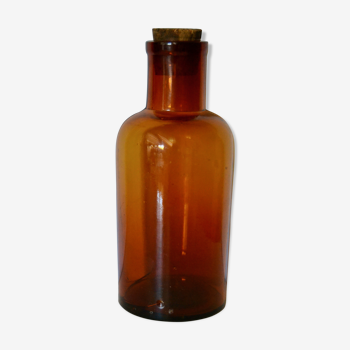 Amber glass apothecary bottle and the cork