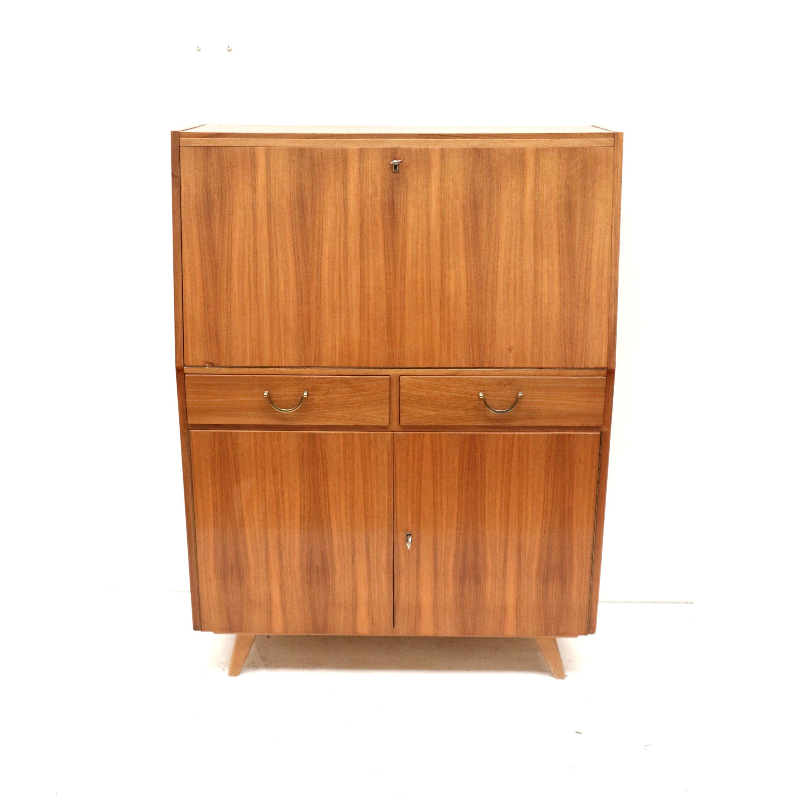 Vintage secretary with drawers, drop-down and doors from the 1960s.