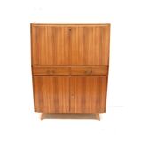 Vintage secretary with drawers, drop-down and doors from the 1960s.