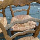 Four Louis XV chairs in solid oak and straw seats, 19th century