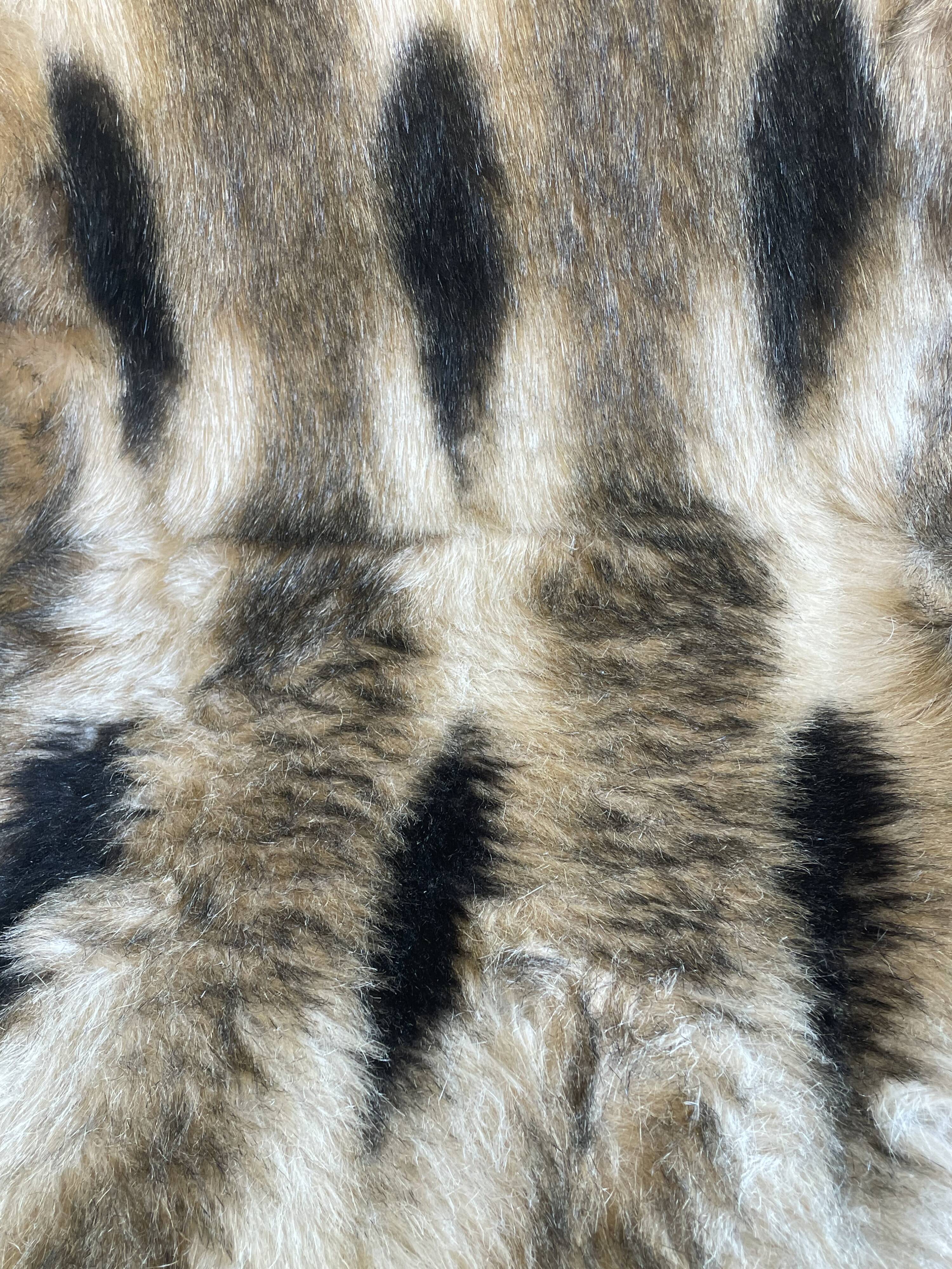 Faux fur chair with patterns & tapered dark wood legs