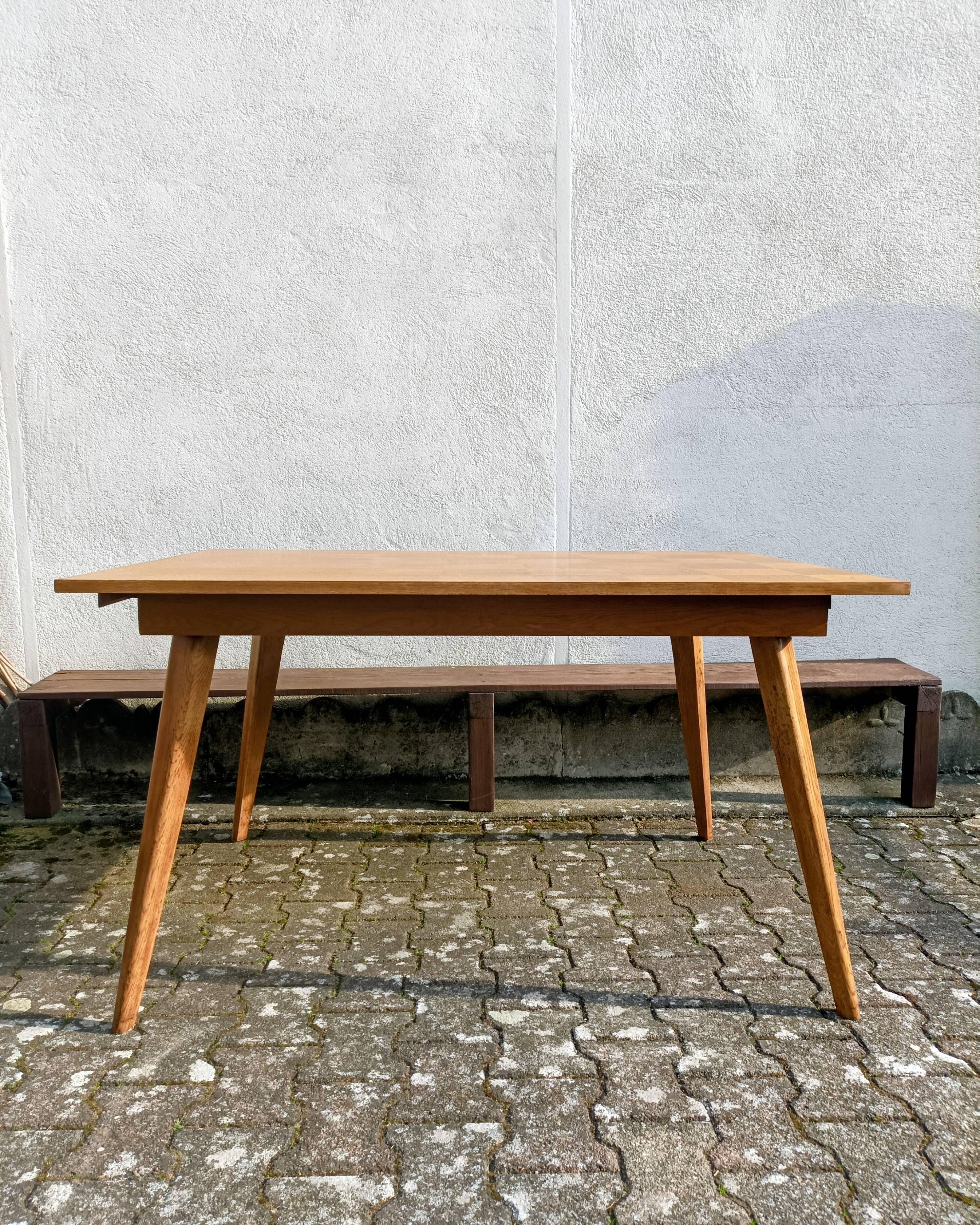 Dining table with tapered legs