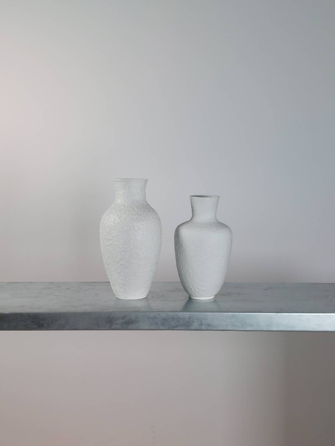 Pair of vintage biscuit porcelain vases by Metzler Ortloff