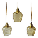 Trio of yellow glass pendant lights