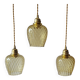 Trio of yellow glass pendant lights