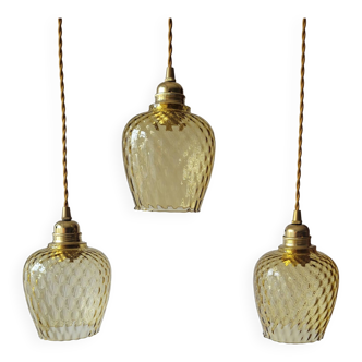 Trio of yellow glass pendant lights