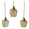 Trio of yellow glass pendant lights