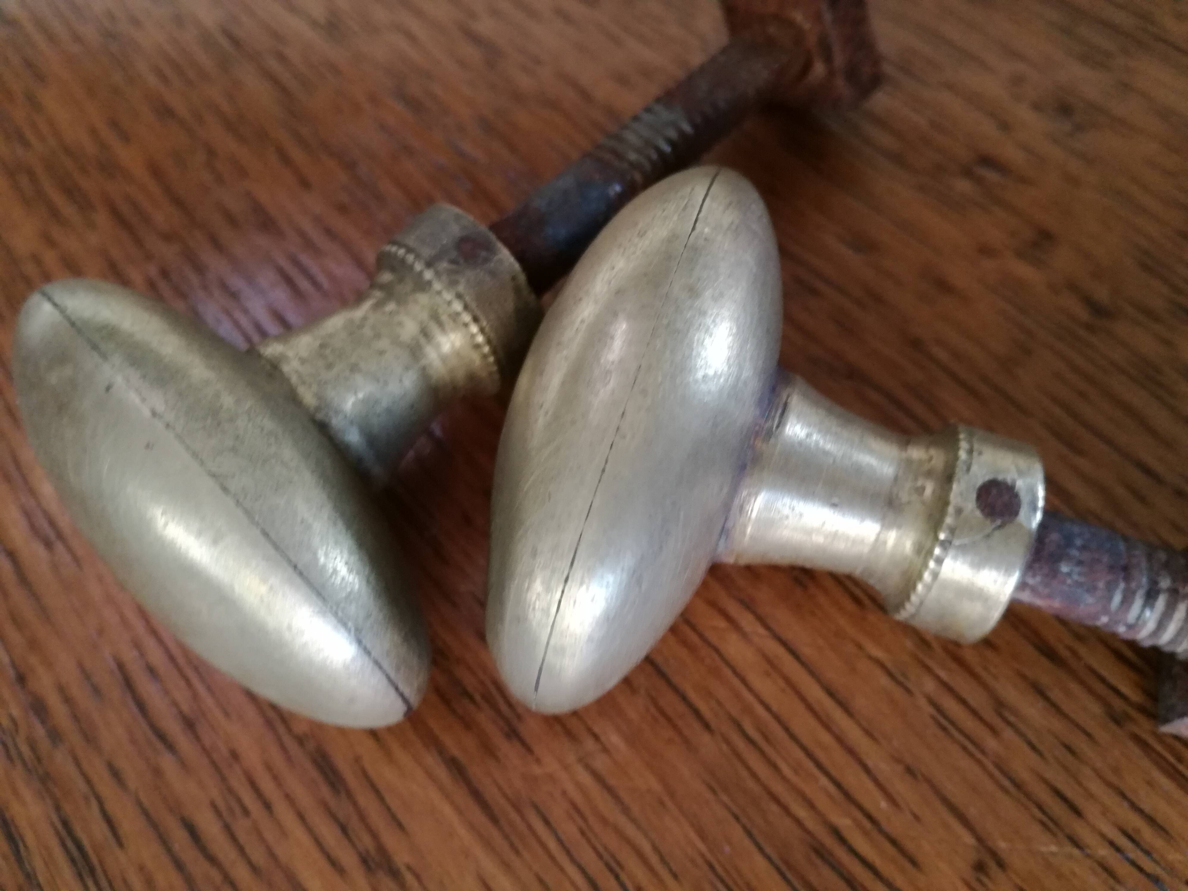 pair of old brass button handles