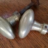 pair of old brass button handles