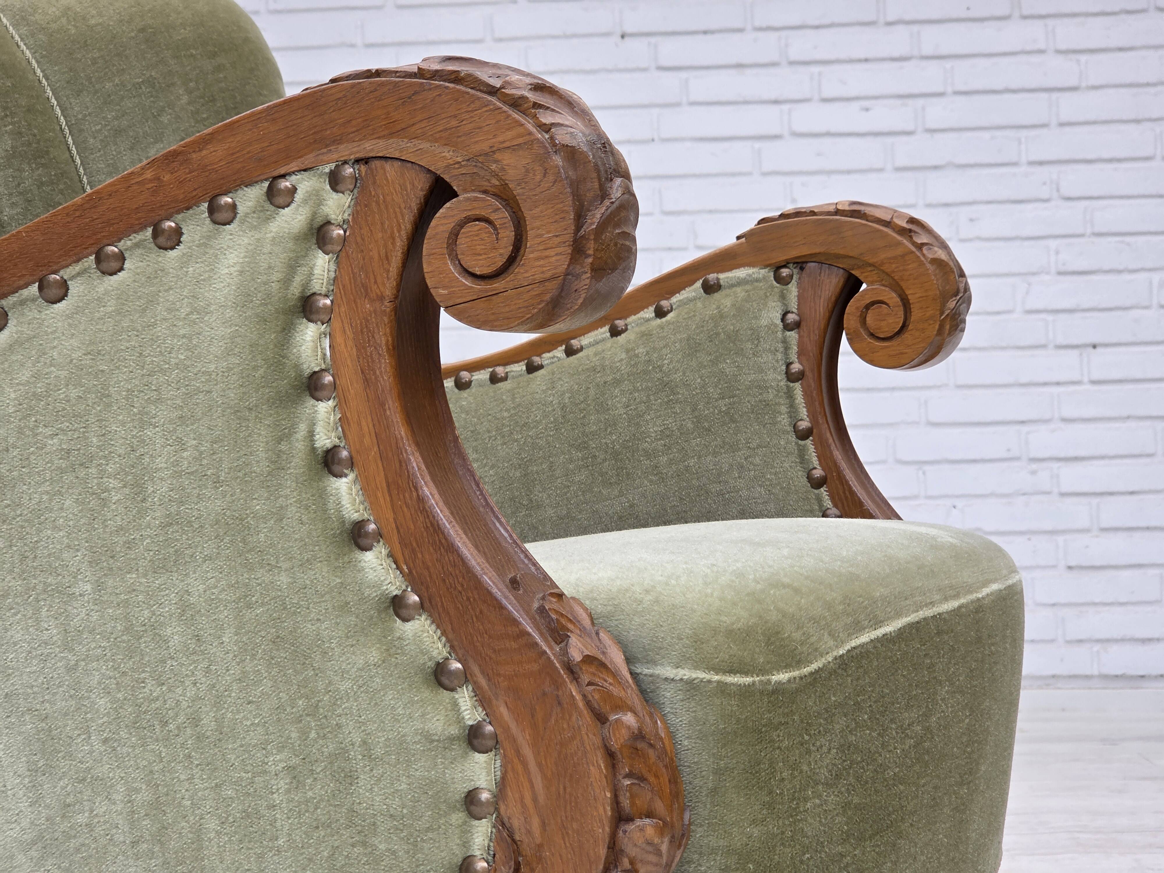 1960s, Danish armchair, green furniture velour, carved oak wood.