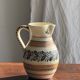 Beige carafe with stylized blue flower friezes
