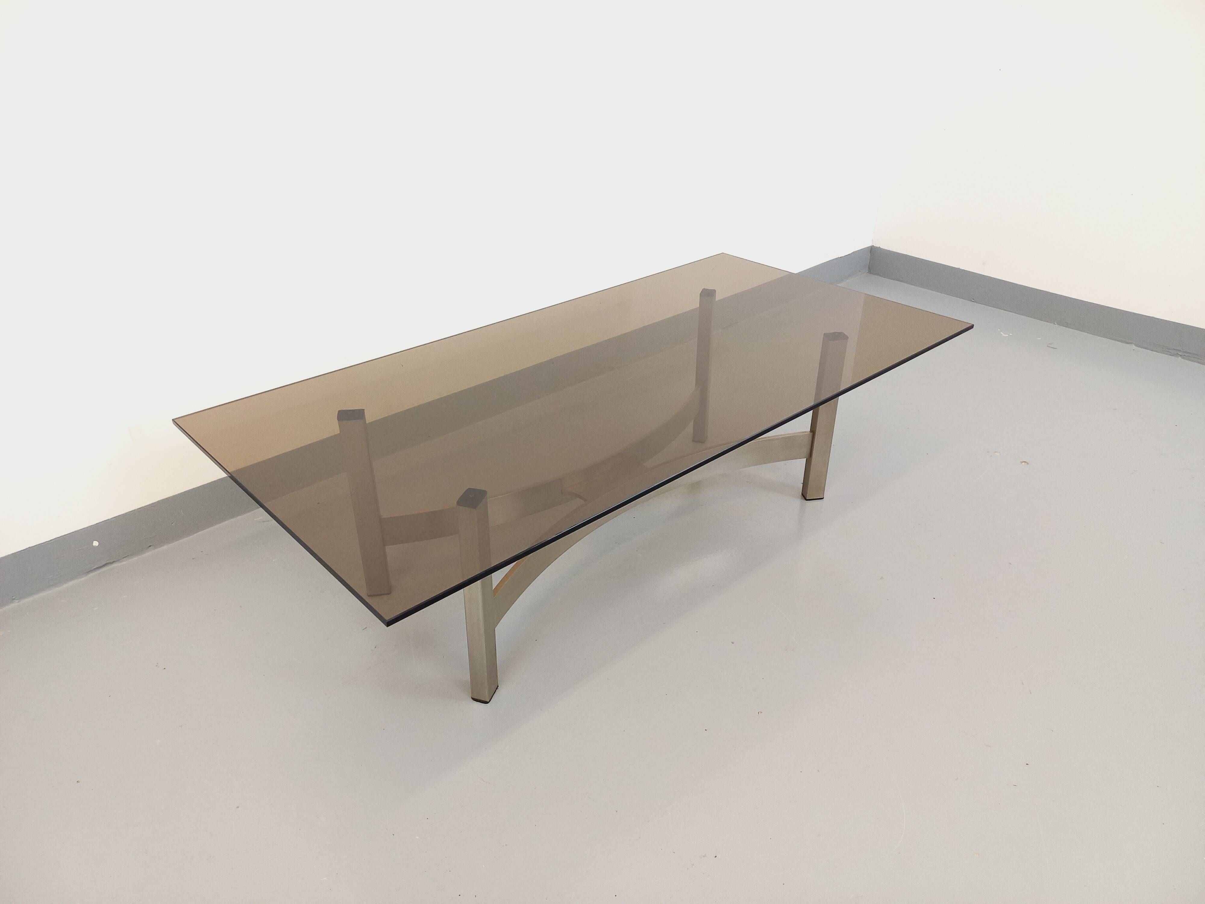Vintage coffee table in smoked glass and brushed cast aluminum from the 70s