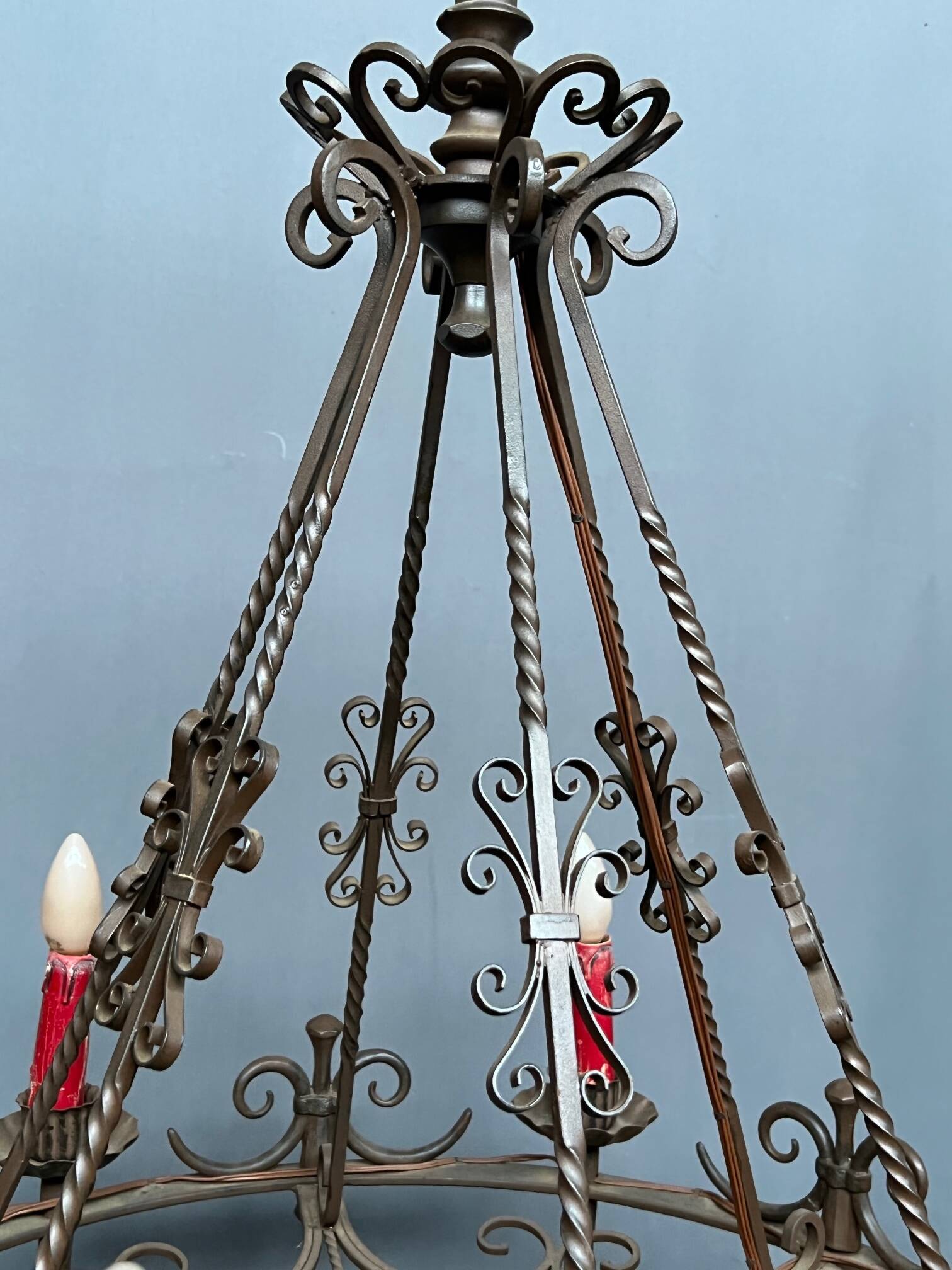 Wrought chandelier in Gothic style.