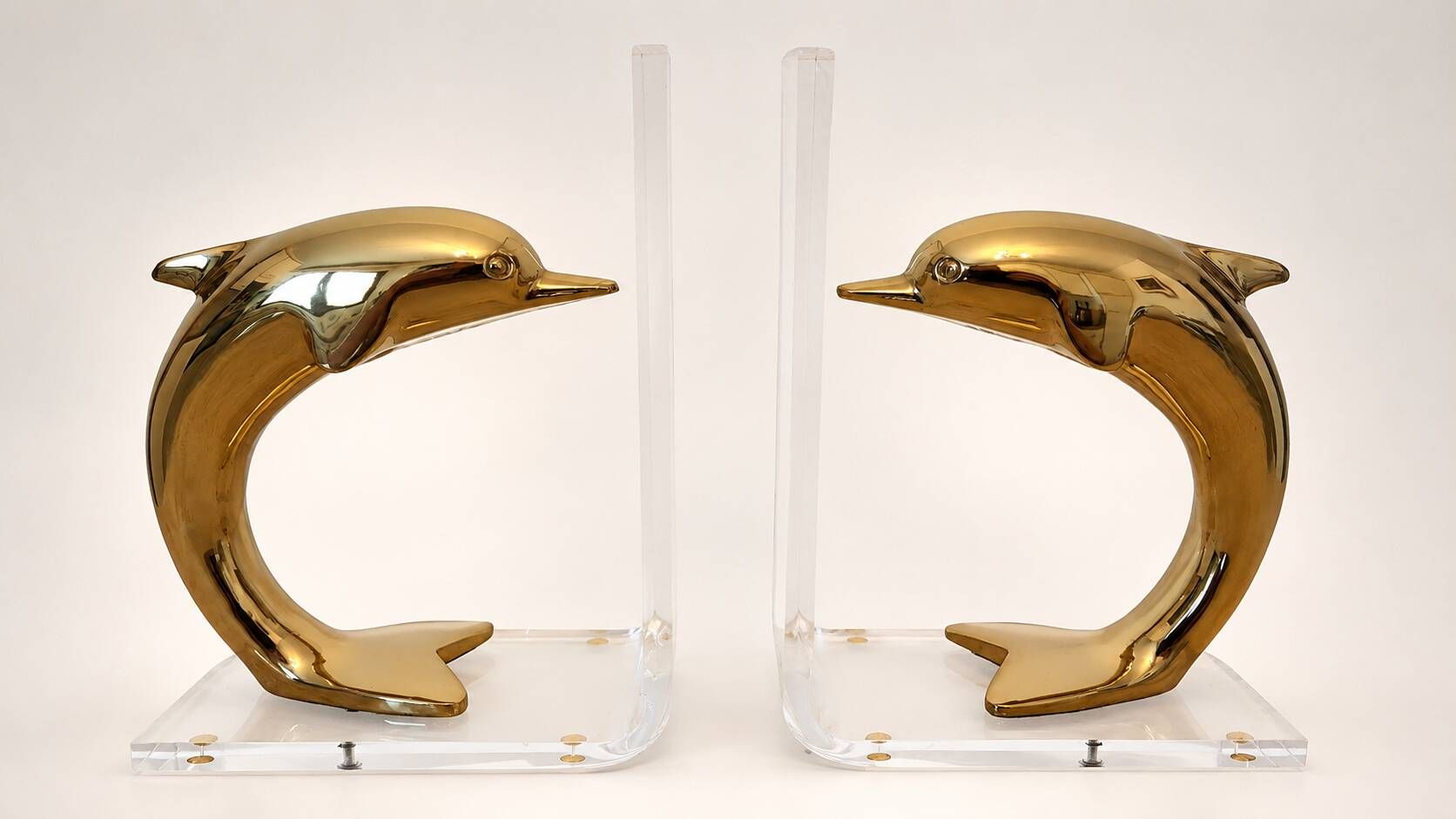 Dolphin bookends in gold metal and plexiglass – 1980s
