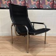 PAIR OF BLACK LEATHER AND CHROME ARMCHAIRS BY HANS EICHENBERGER 1960.
