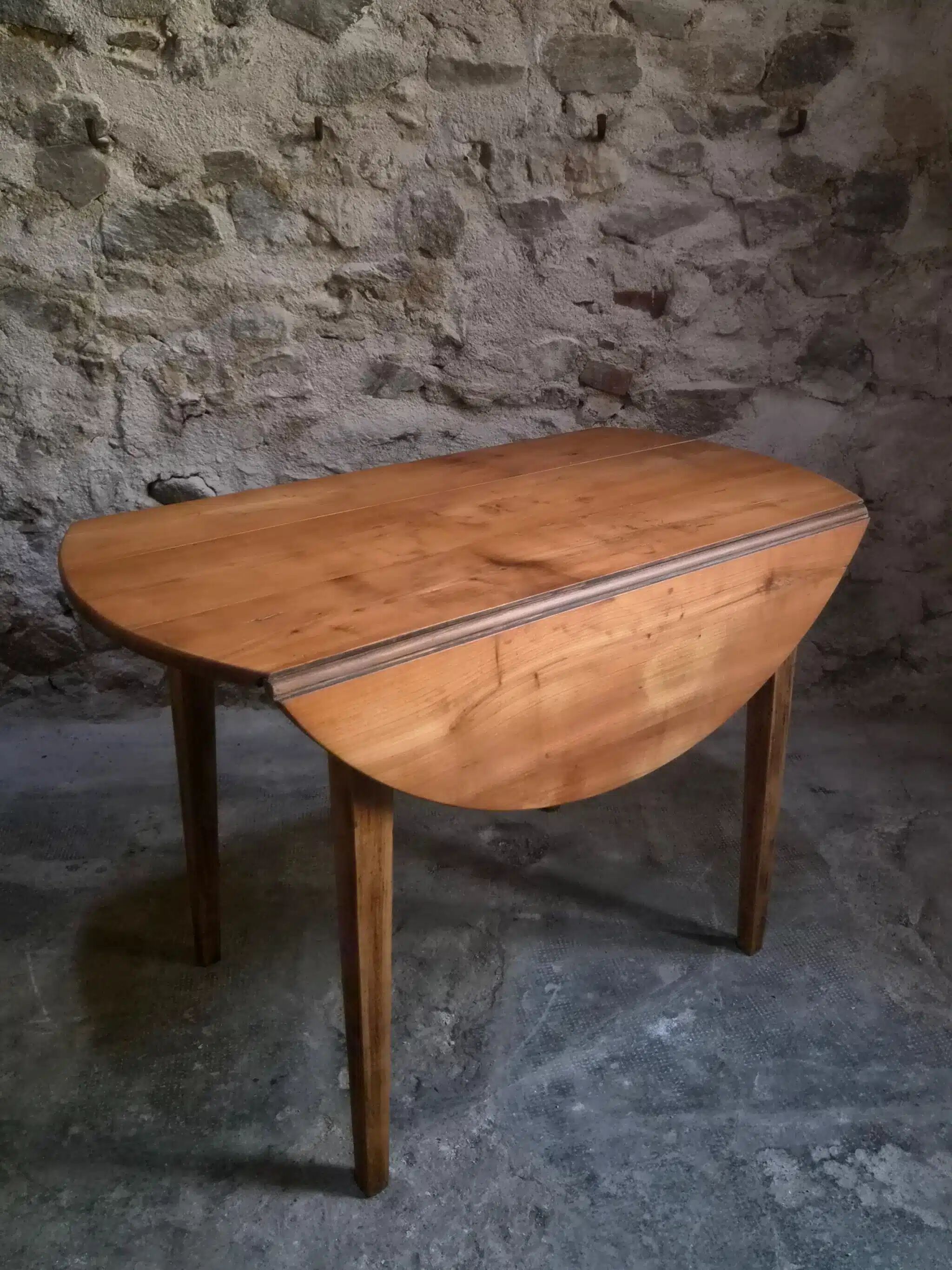 Rustic French antique dining table, drop-leaf table in cherry wood, circa 1900.