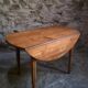 Rustic French antique dining table, drop-leaf table in cherry wood, circa 1900.