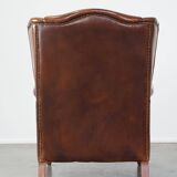 Fauteuil à oreilles en cuir de vachette cognac