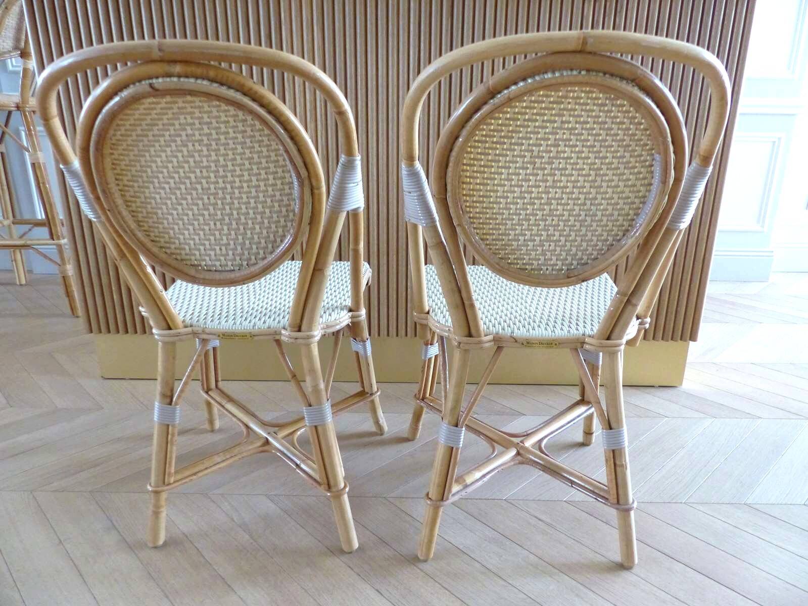 Pair of Parisian bistro chairs from Maison Louis Drucker in light Manila rattan.