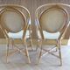 Pair of Parisian bistro chairs from Maison Louis Drucker in light Manila rattan.