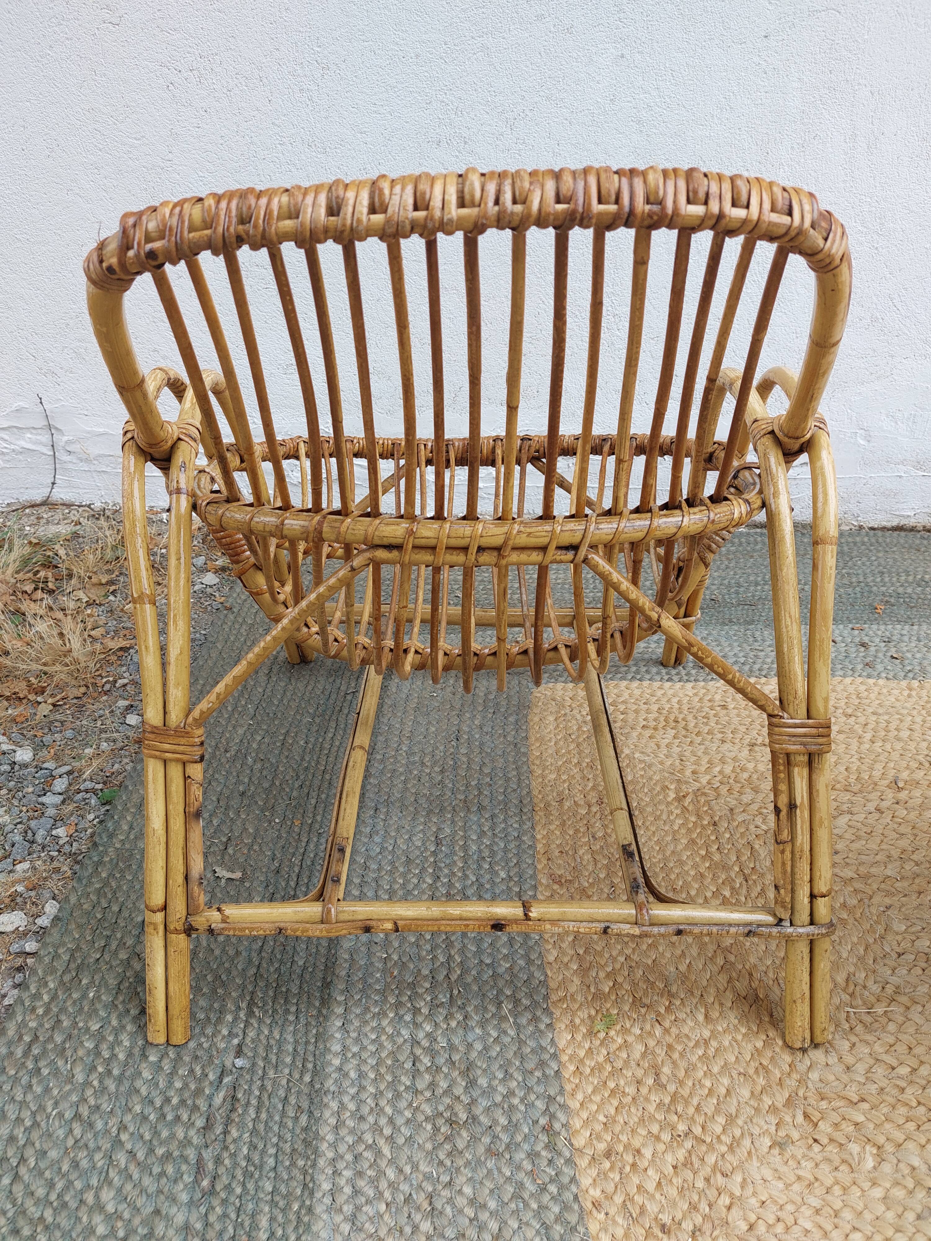 4 armchairs and a coffee table made of rattan and bamboo wood, vintage.