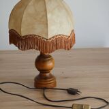 Table lamp in turned wood and umbrella-style leather lampshade