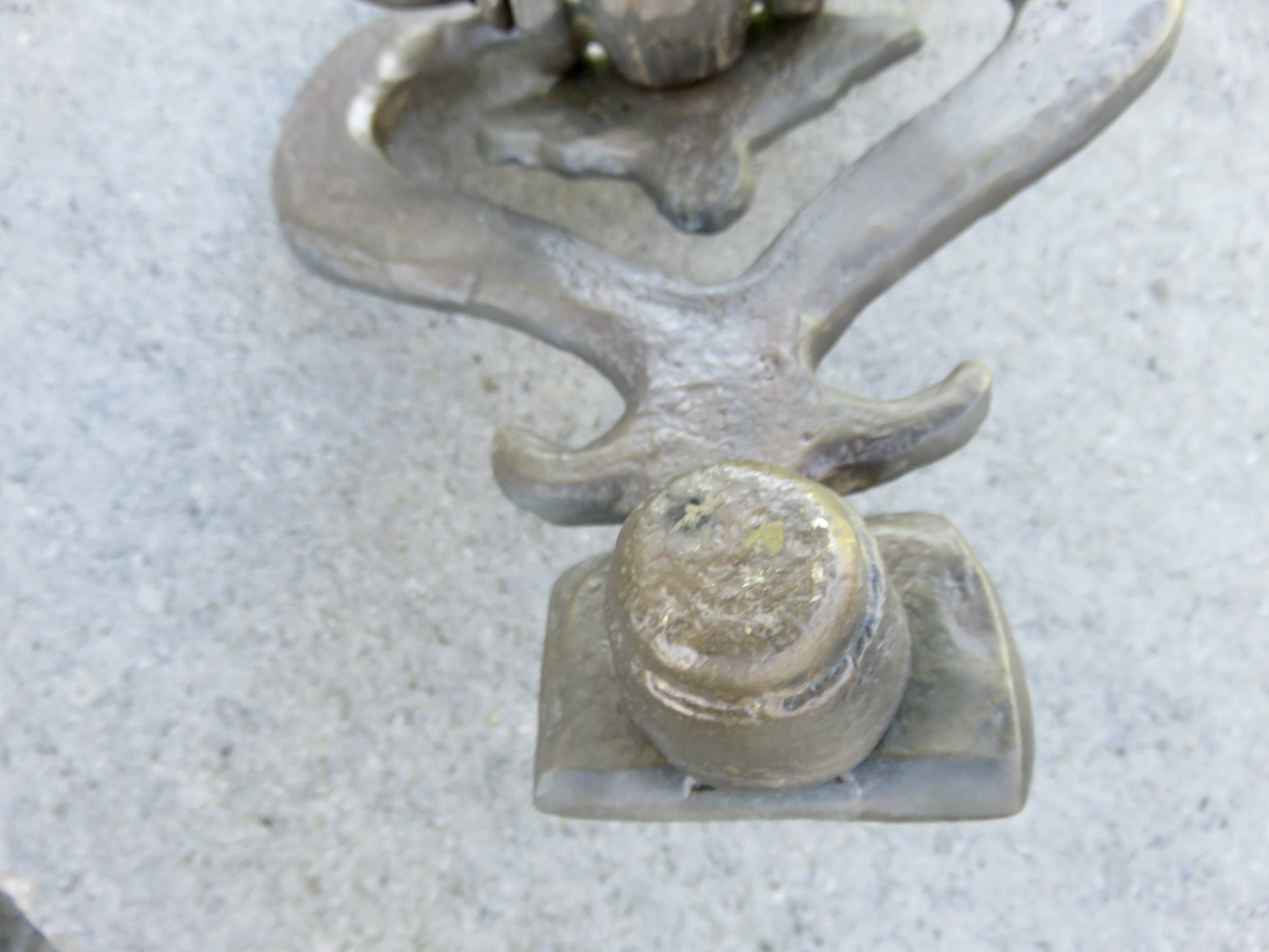 Impressive door knocker from the High Middle Ages in solid bronze.