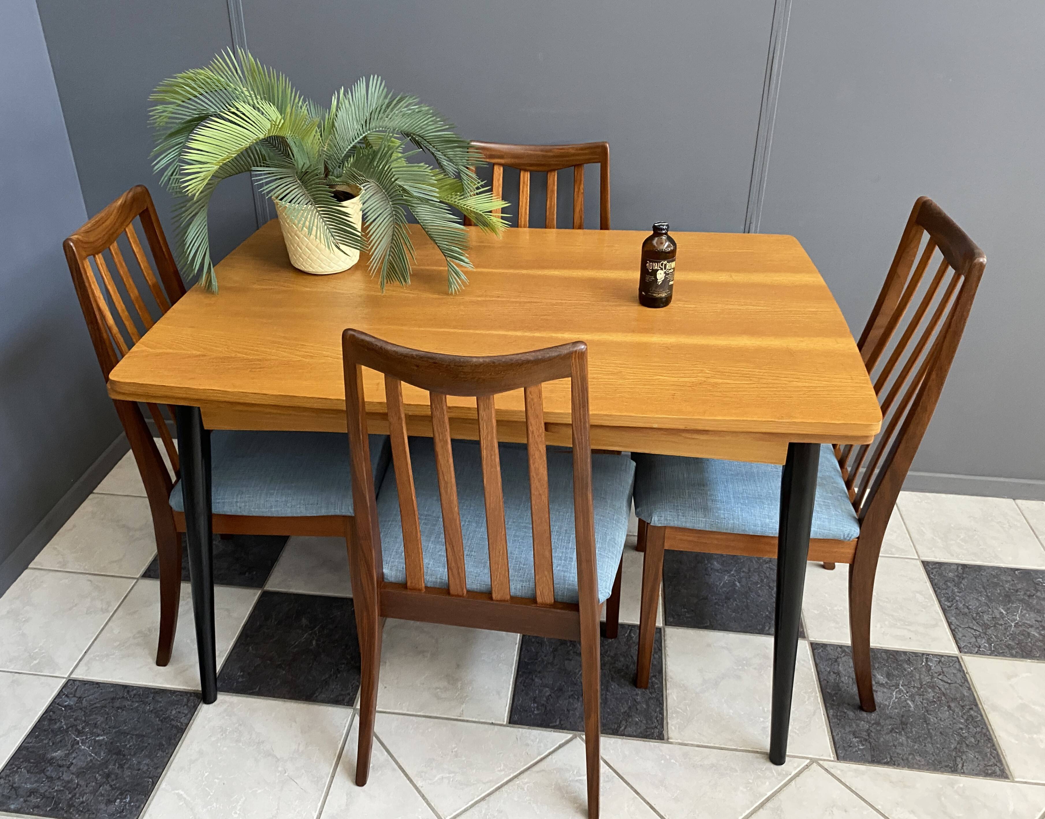 Wood enlarging dining table black wood legs 1960s