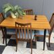 Wood enlarging dining table black wood legs 1960s