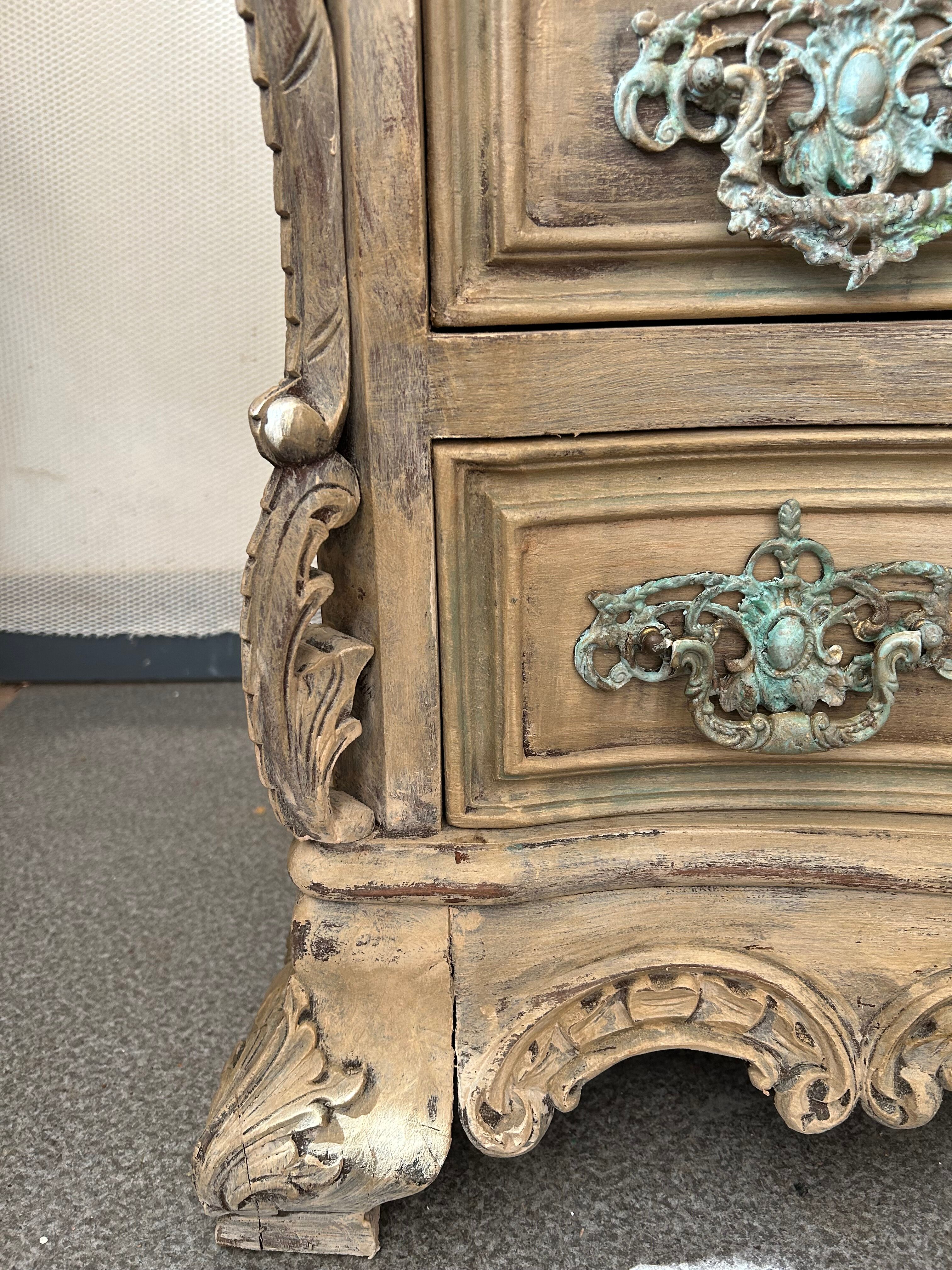 Patinated baroque crossbow chest of drawers