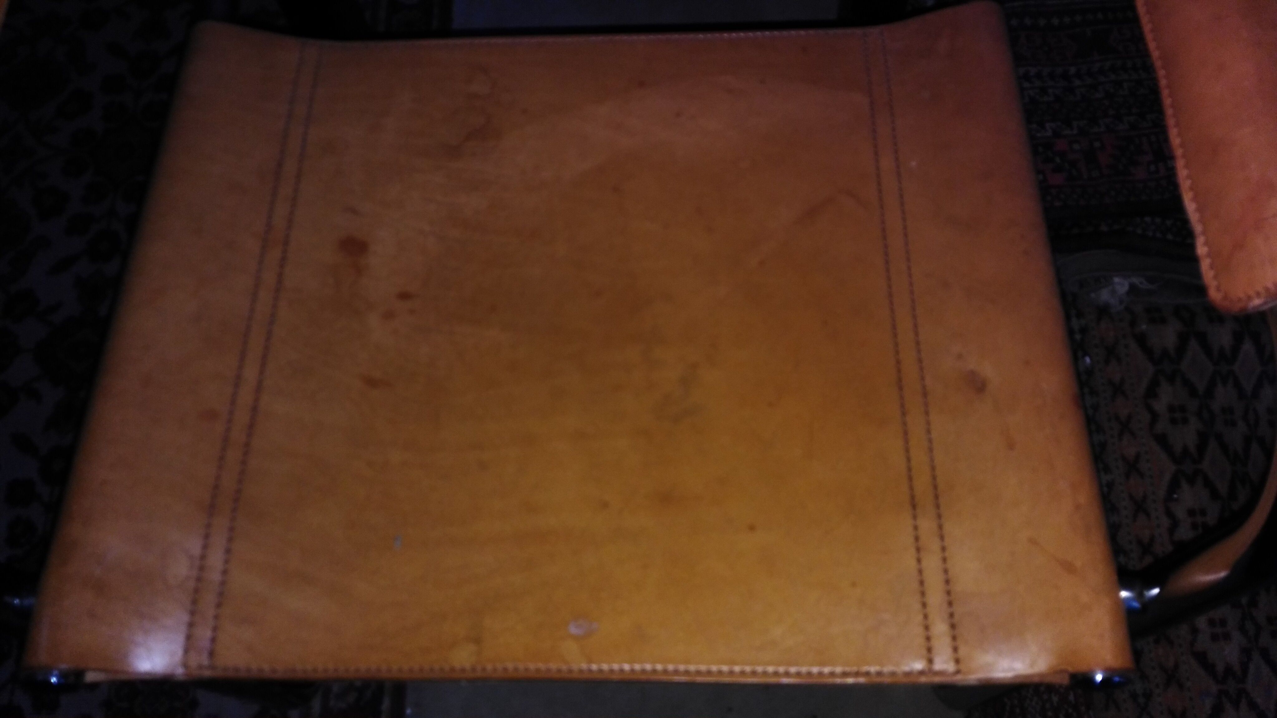 Three  leather armchairs