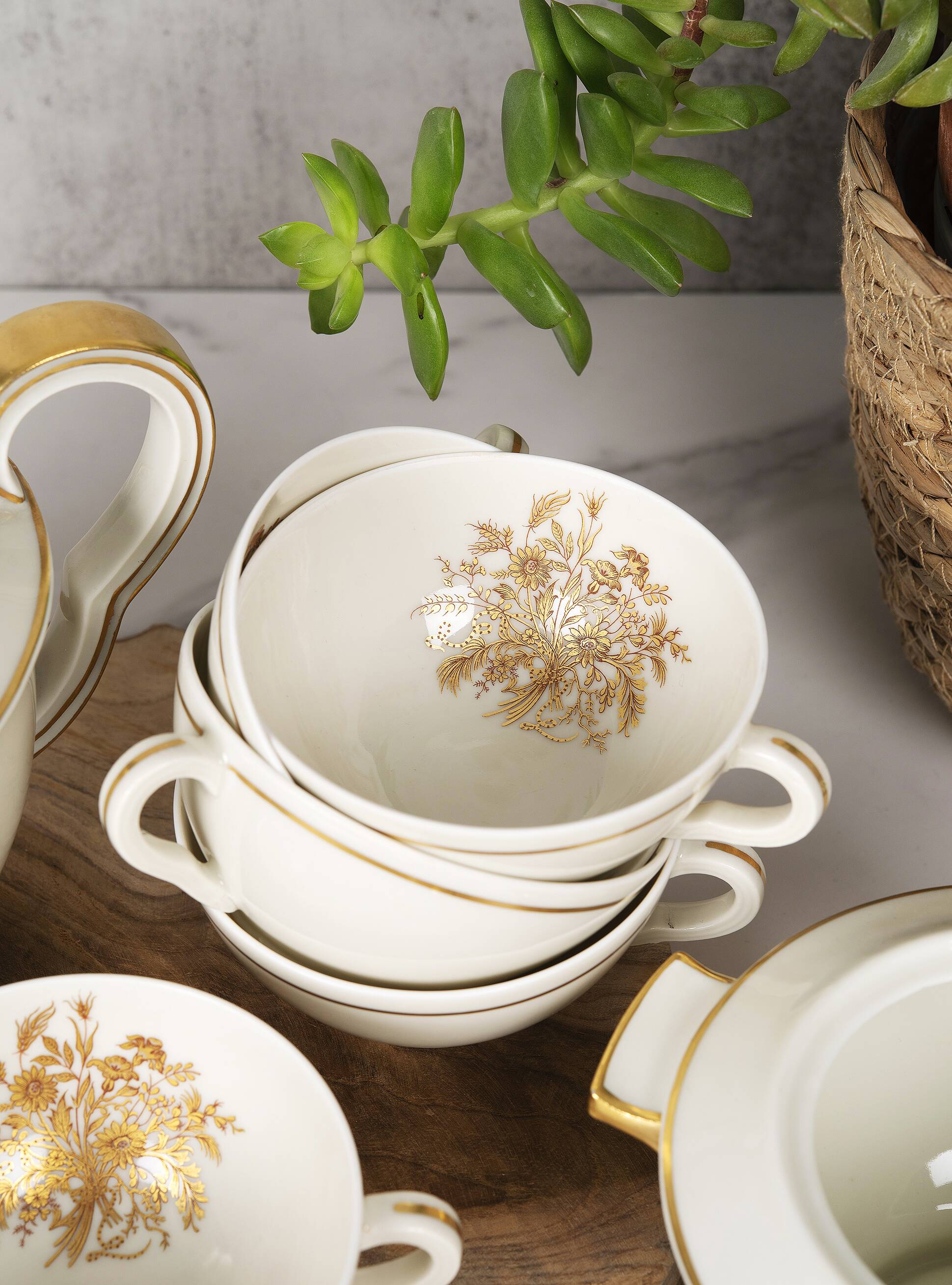 Porcelain tea service by Théodore Haviland, gilded patterns.
