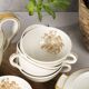 Porcelain tea service by Théodore Haviland, gilded patterns.